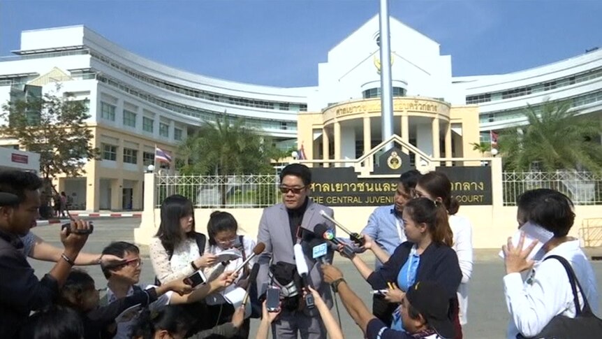 Thai lawyer Kong Suriyamonthon talks to the media.
