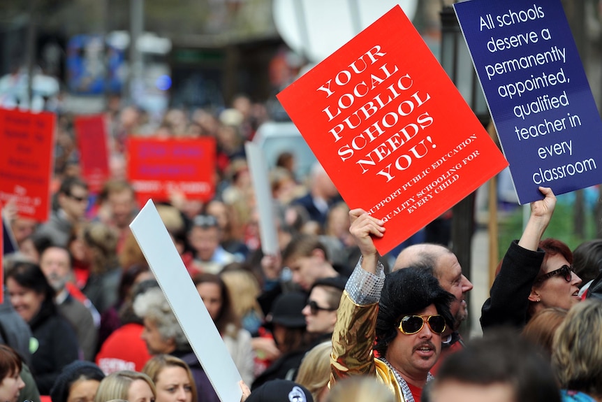 NSW teachers arrive for a strike meeting in Sydney.