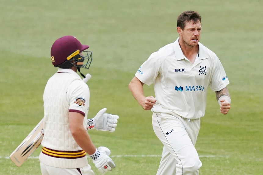 James Pattinson clenches his fists and runs past a batsman