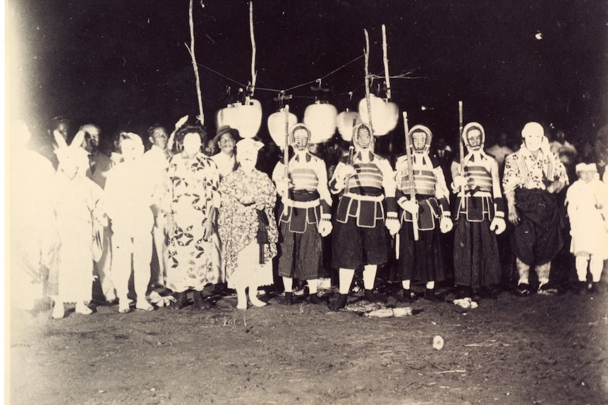 black and white photo of people in kimonos and kendo gear