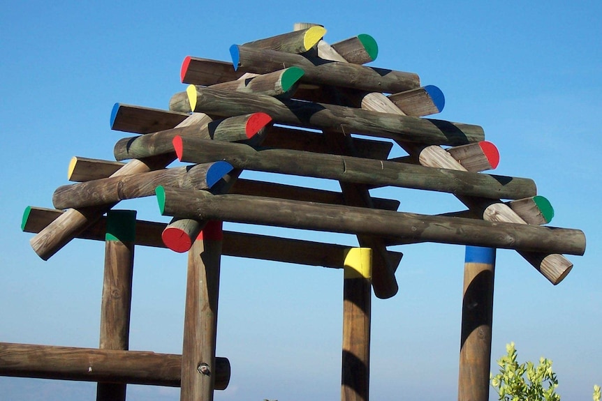 Koppers Inc treated logs with chemicals for use in playgrounds and landscaping.
