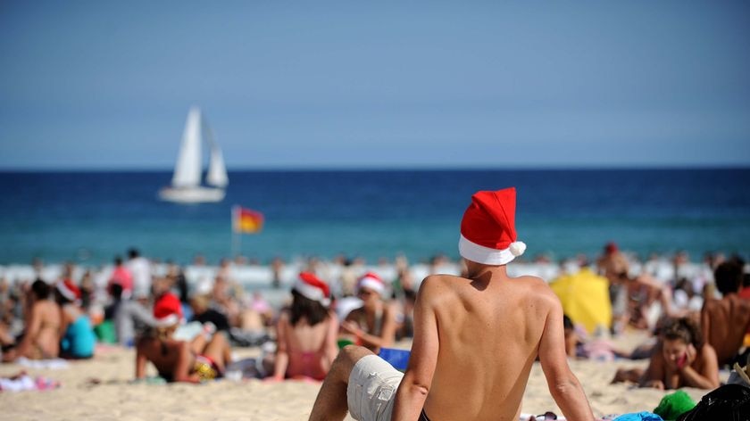 Tourists and locals assemble on Bondi Beach