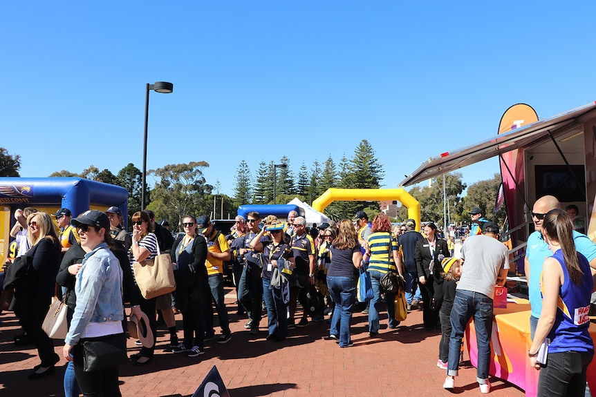 Crowds dressed in the colours of the West Coast Eagles at the final football game at Subiaco Oval.