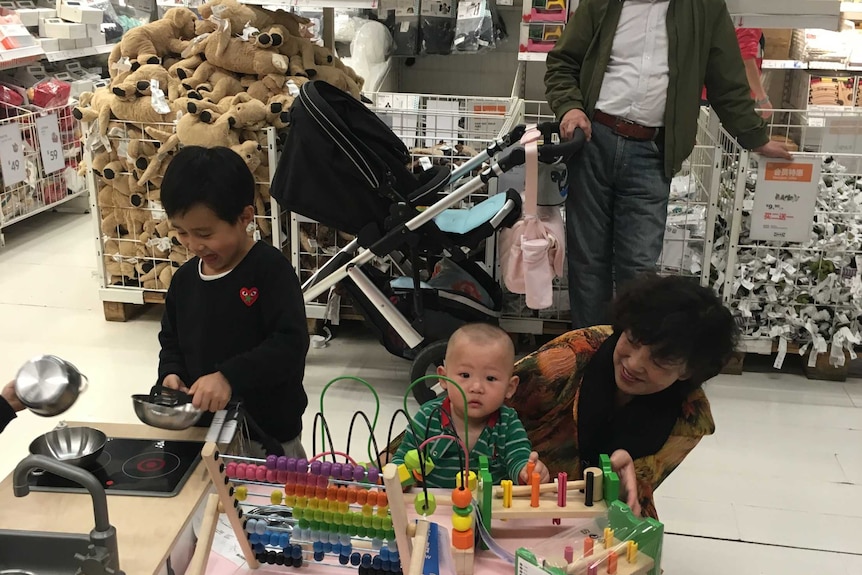 Ikea customers play with toys