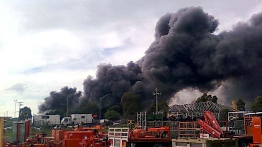 Thick smoke billows from a fire at an automotive chemical plant in Dandenong Sth