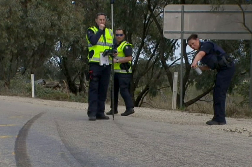 Police at the scene where three men died in a single car crash on the Boort-Kerang Road.