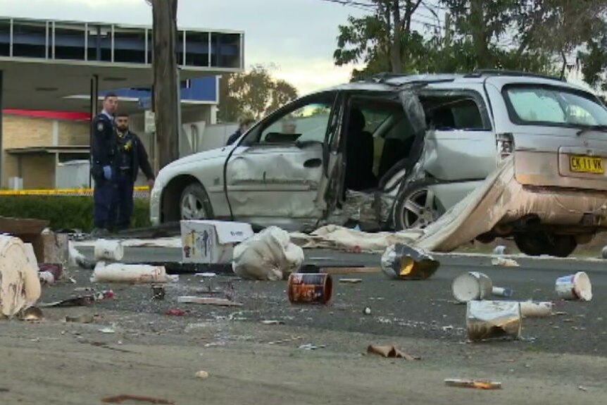 A woman was found dead on the footpath after a car crash at Chester Hill in Sydney's west.