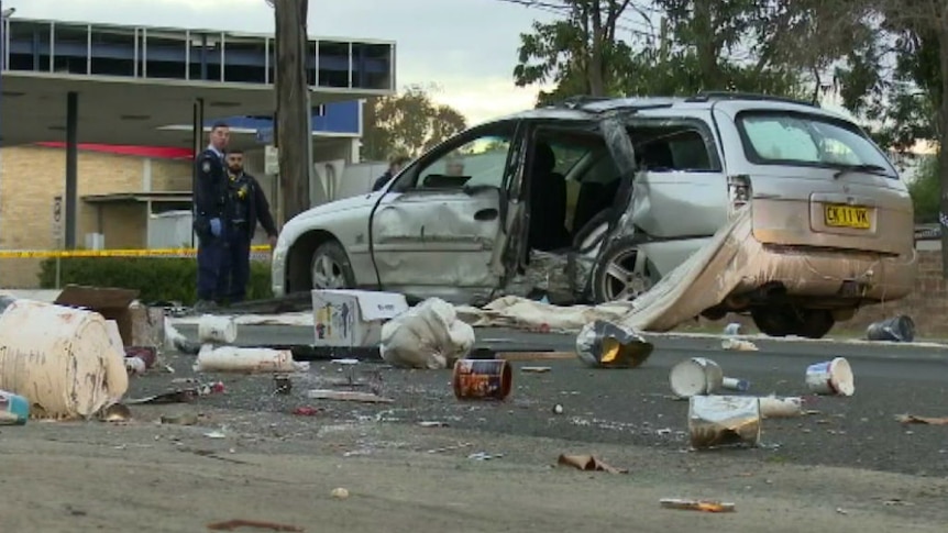 A woman was found dead on the footpath after a car crash at Chester Hill in Sydney's west.
