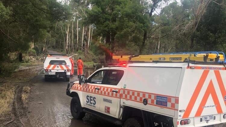 Two SES vehicles on a muddy road.