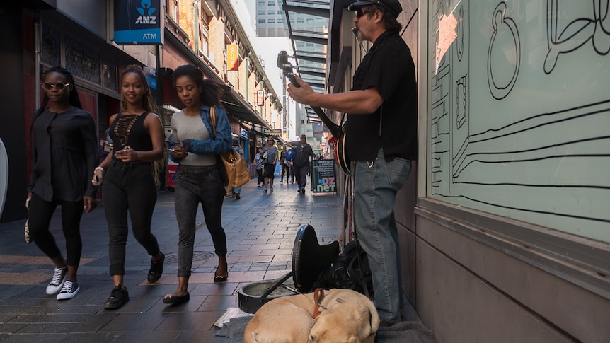 Anthony Clarke busking in James Place.