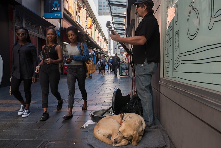 Anthony Clarke busking in James Place.