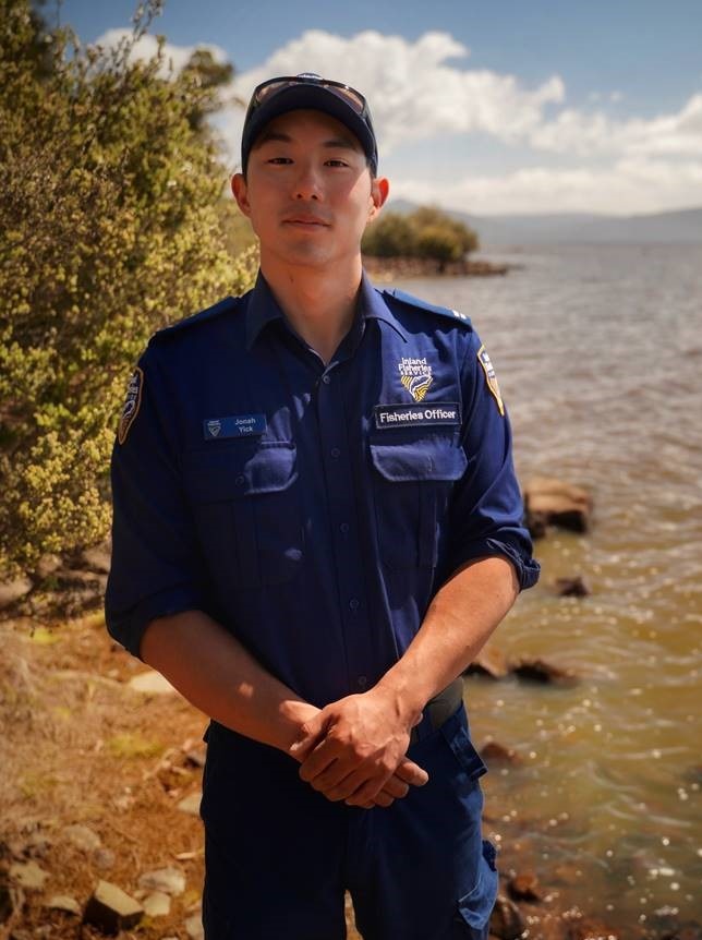 Jonah Yick stands next to Lake Sorell.