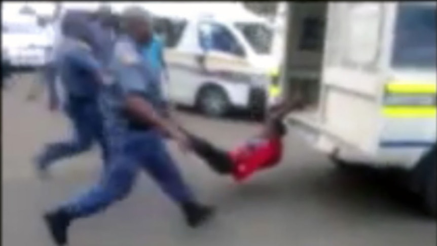 South African man dragged behind police van