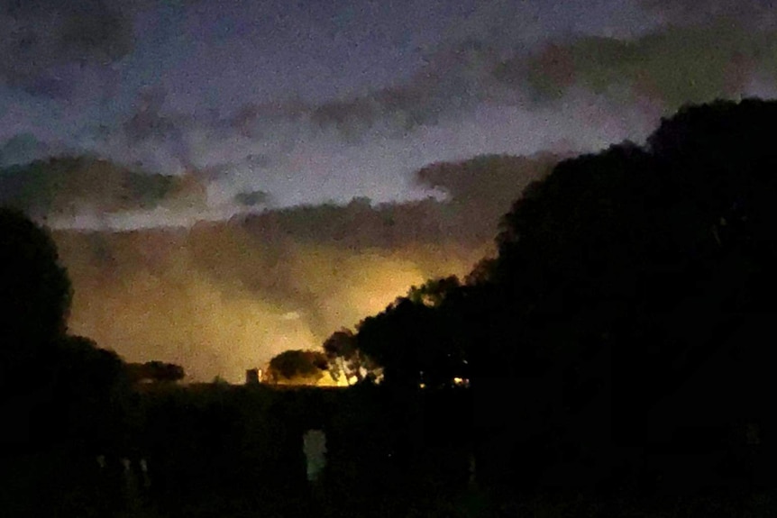 Smoke rises into the night sky above Greenough Regional Prison.