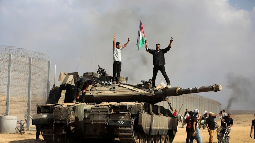 Palestinians wave their national flag and celebrate.