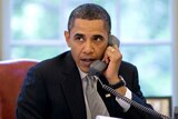 US President Barack Obama speaks on the phone