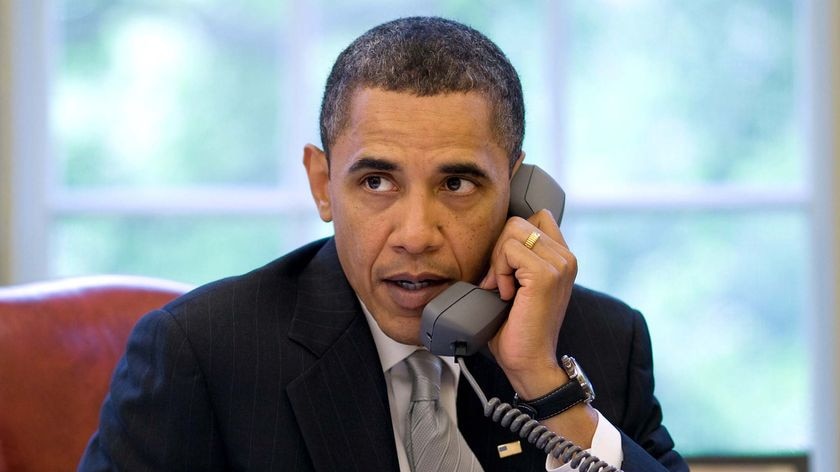 US President Barack Obama speaks on the phone