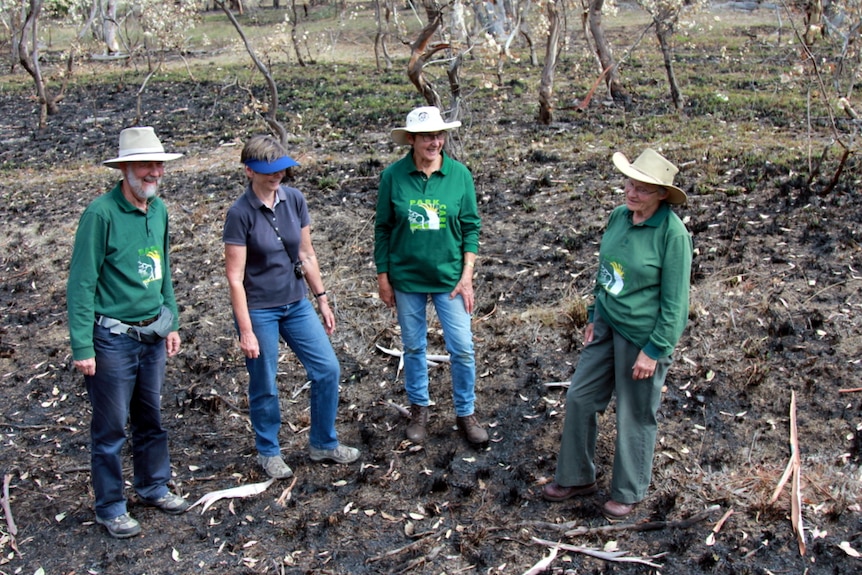 Land carers inspect the Mt Painter reserve following a controlled burn.