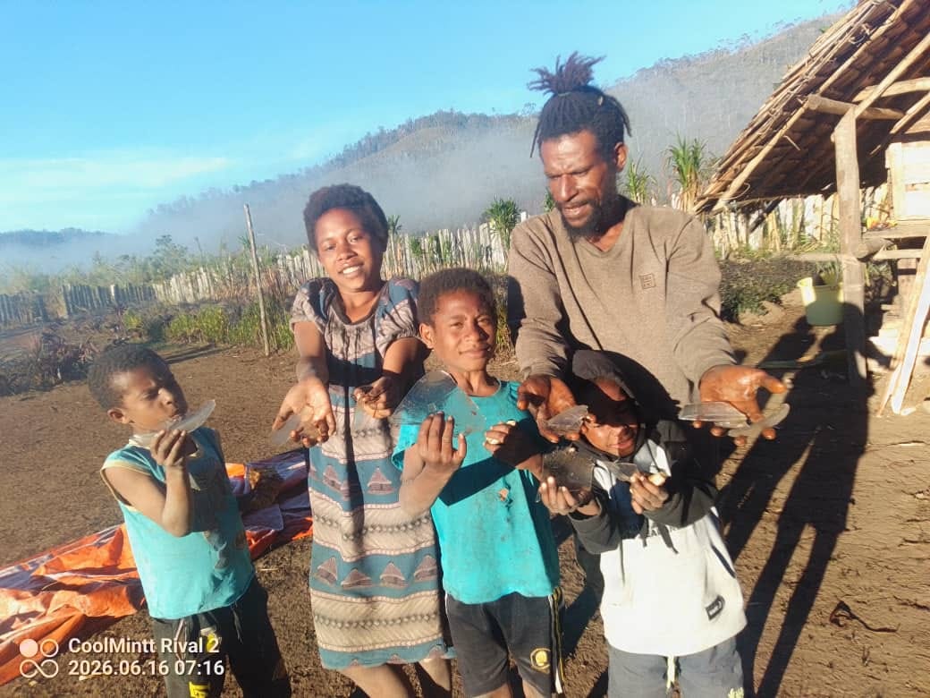 A family hold shards of ice in front of them.