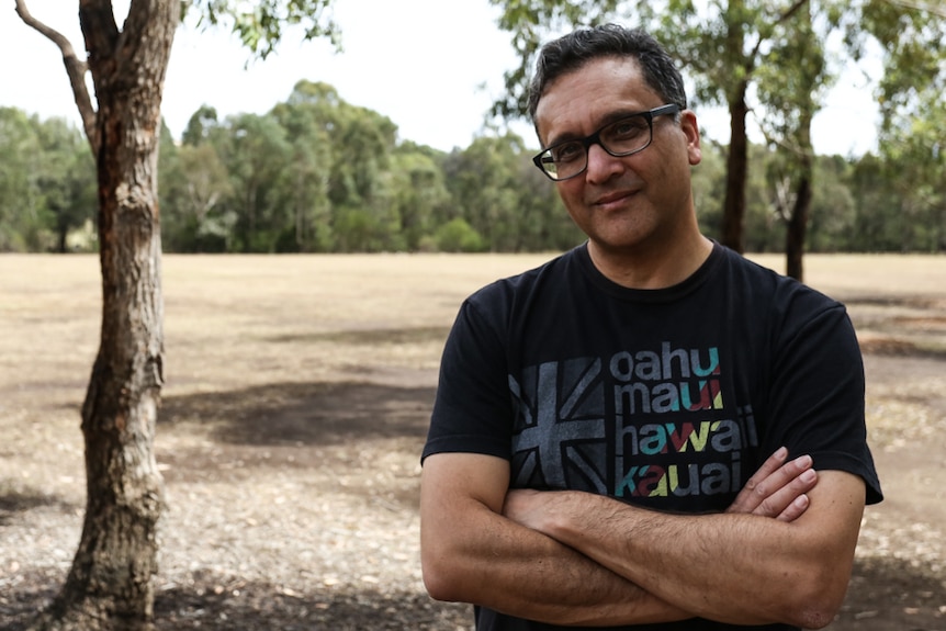 Author Greg de Moore pictured in a park in Parramatta in Sydney.