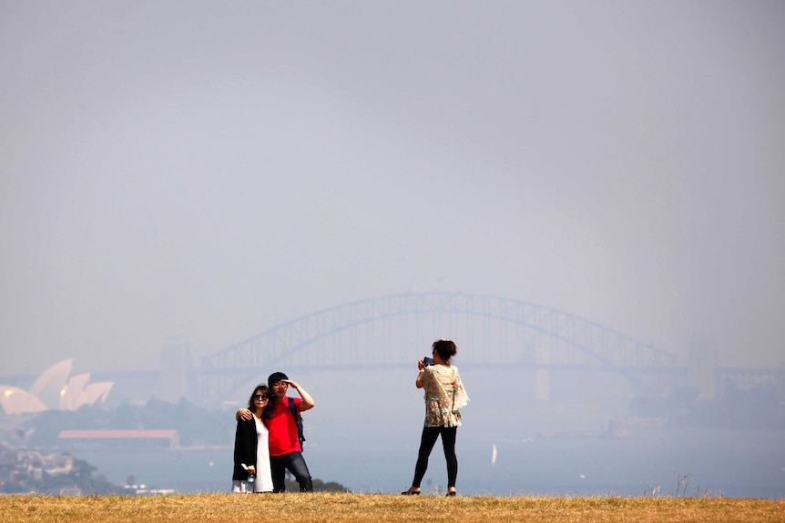 Smoke from bushfires obscure the Sydney Opera House and Harbour Bridge