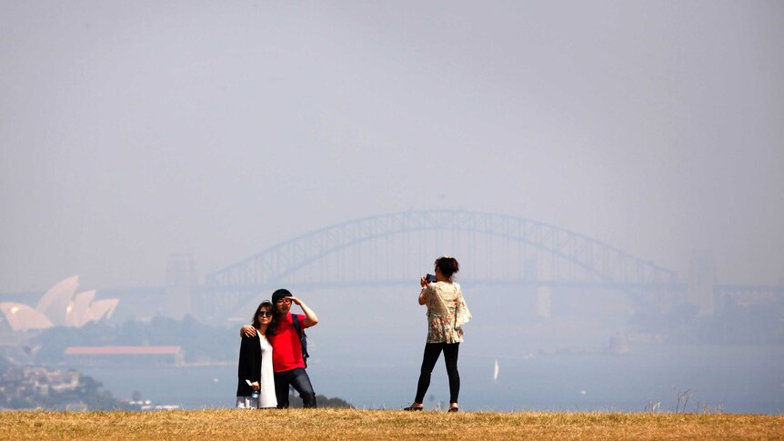 Smoke from bushfires obscure the Sydney Opera House and Harbour Bridge