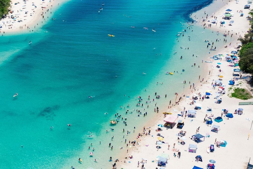 An aerial shot of a crowded beach.