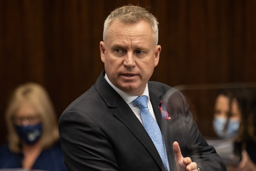 Jeremy Rockliff gestures while speaking in parliament.