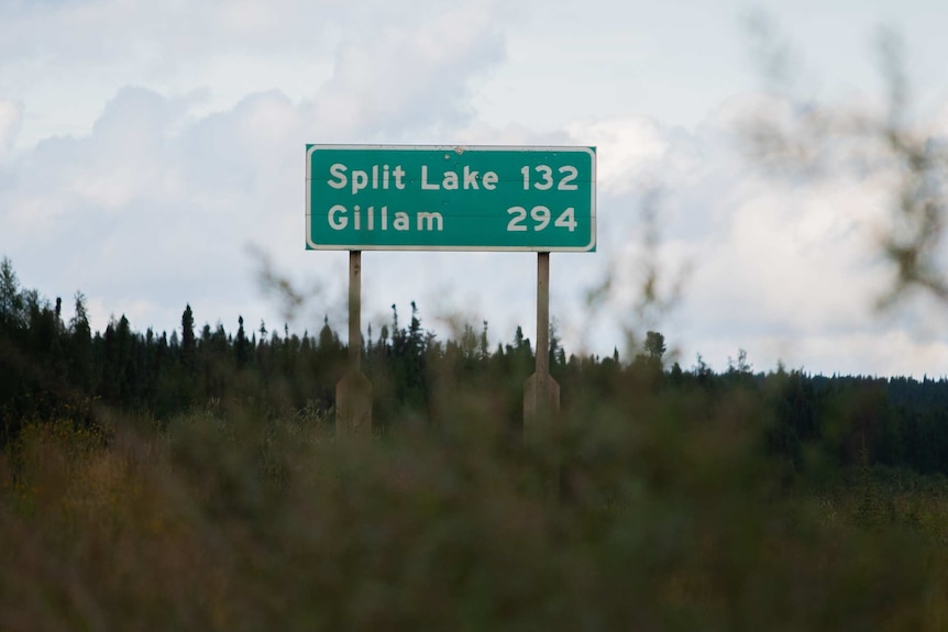A street sign reading "Split Lake and Gillam"