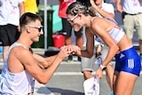 A Slovakian male athlete on one knee proposes to his partner at the end of a race walk at the World Athletics Championships.