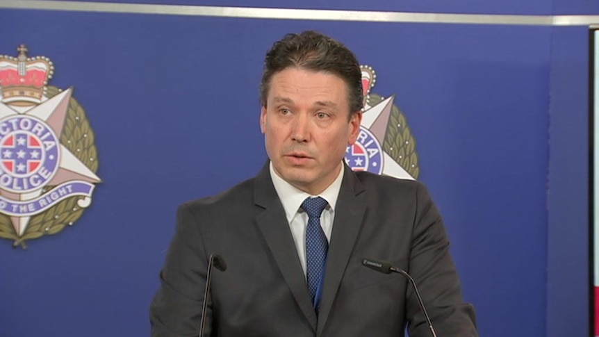 Detective Inspector Tim Day of the Homicide Squad addresses the media.