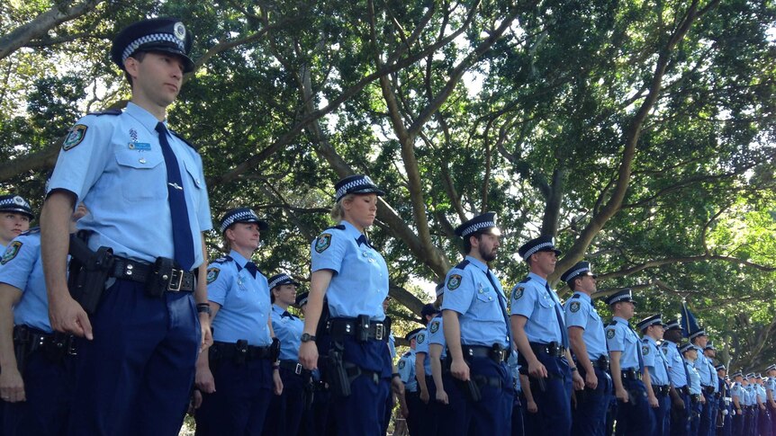 NSW Police stand after march in Hyde Park