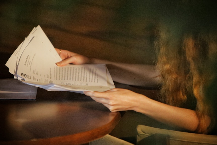 Unidentified woman looks at medical records