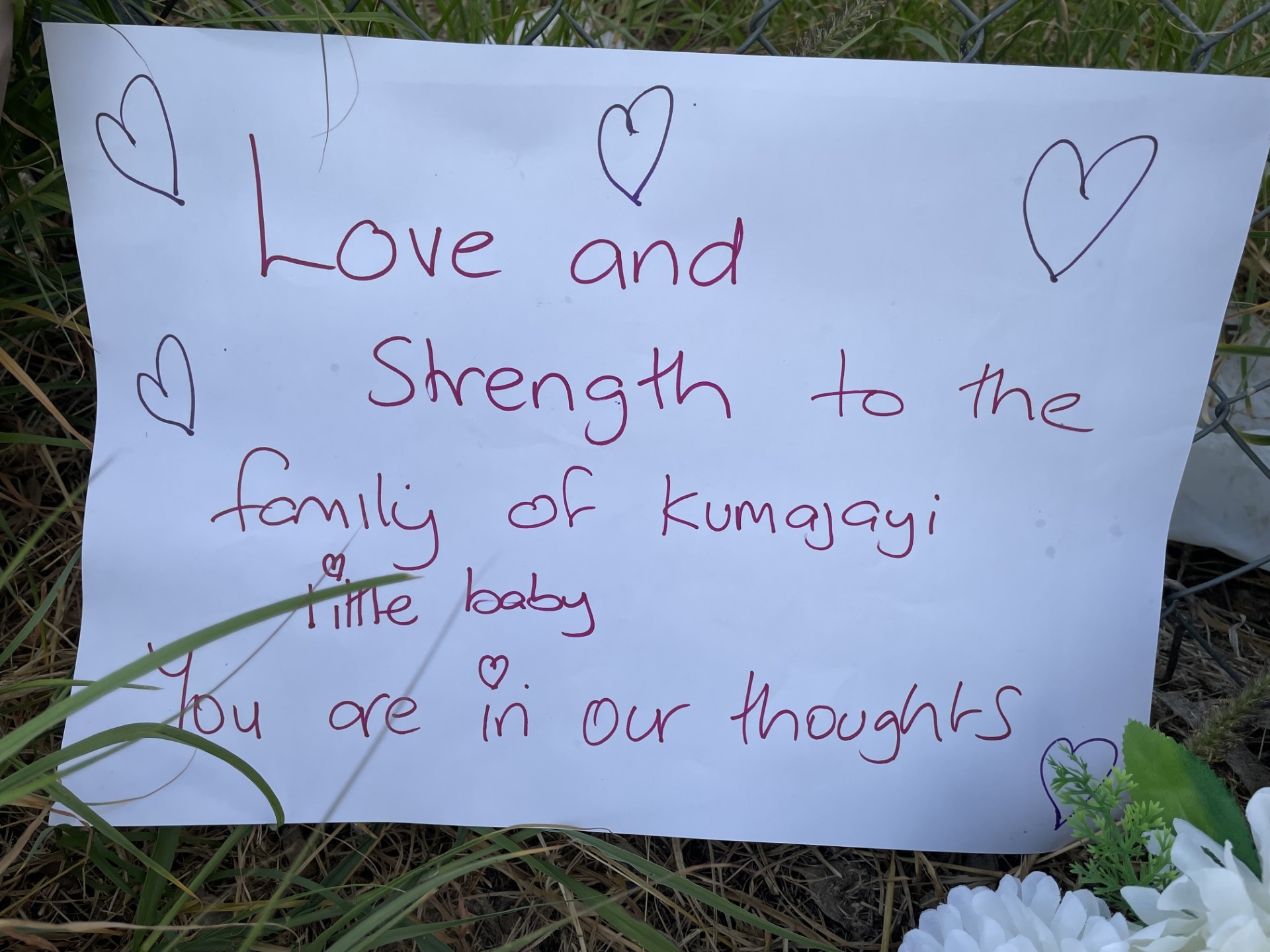 a sign for condolences for little girl