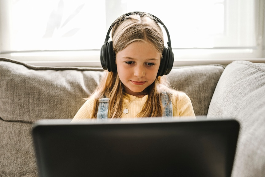 Girl e-learning with headphones