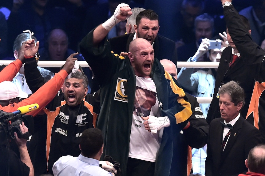 Tyson Fury celebrates after becoming the new heavyweight boxing champion of the world