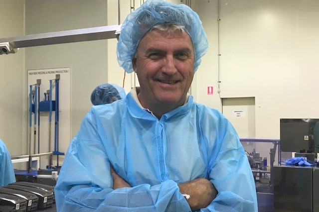 John O'Hara dons blue scrubs inside the Sunny Queens factory.