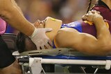 Stefan Martin of the Lions is stretchered from the field