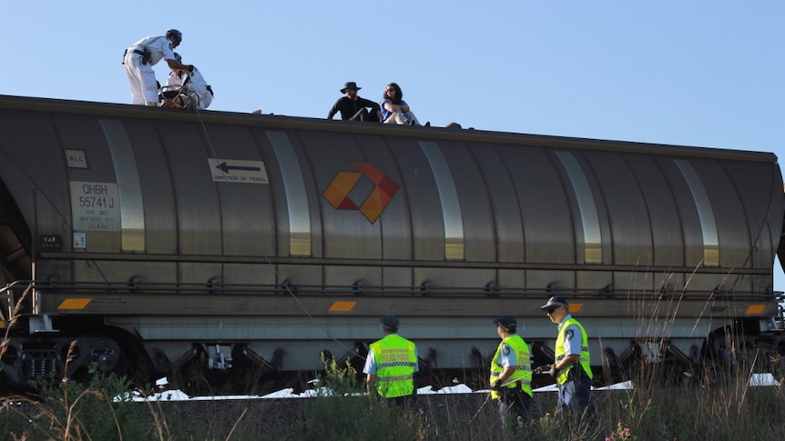 Protestors sitting on top of the first train load of coal from the Maules Creek mine