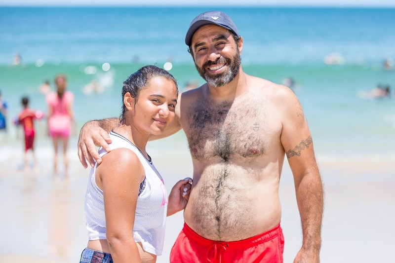 Syrian refugees 13-year-old Patil Stepan and her father on their very first trip to the beach.