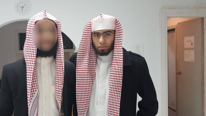 Two young men with Arab scarves.