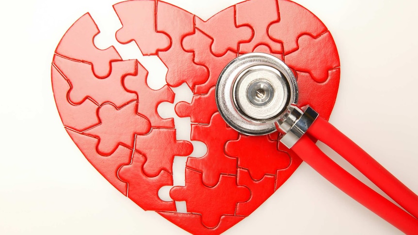 broken heart puzzle with stethoscope