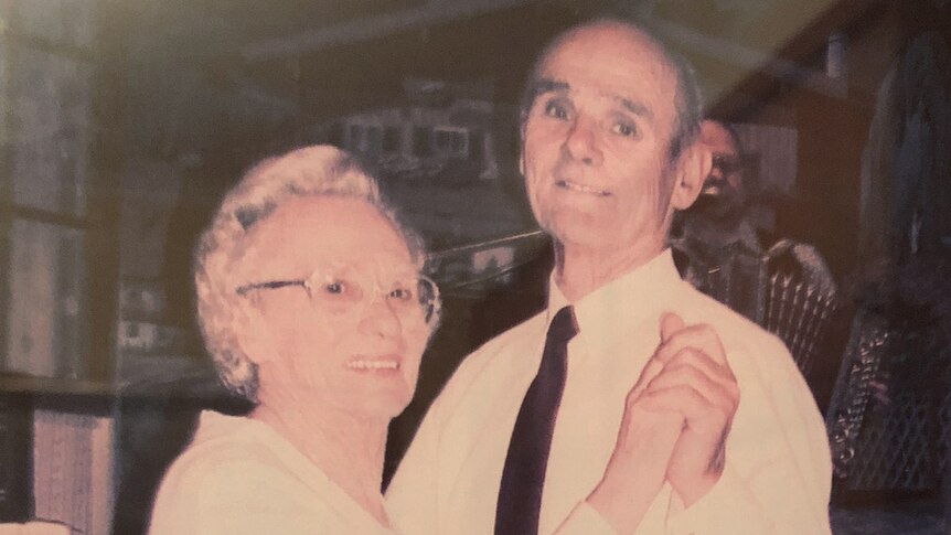 A photograph of Frans and Wilhelmina dancing in their late middle age, holding hands and smiling.