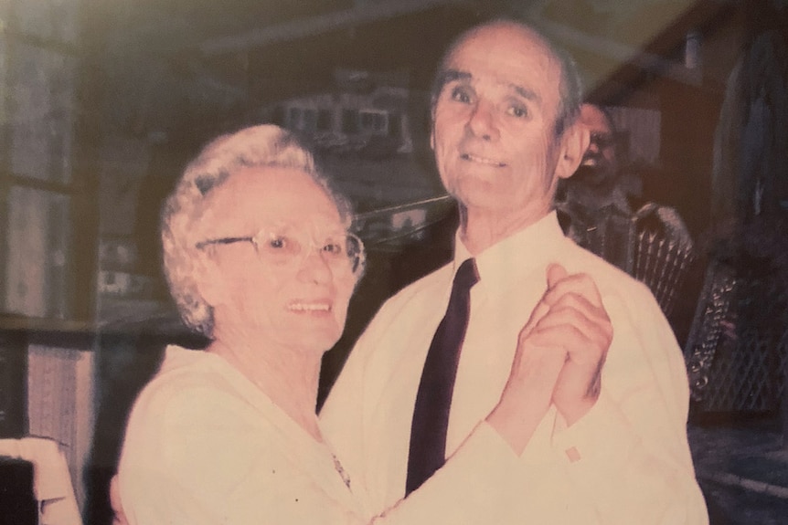 A photograph of Frans and Wilhelmina dancing in their late middle age, holding hands and smiling.