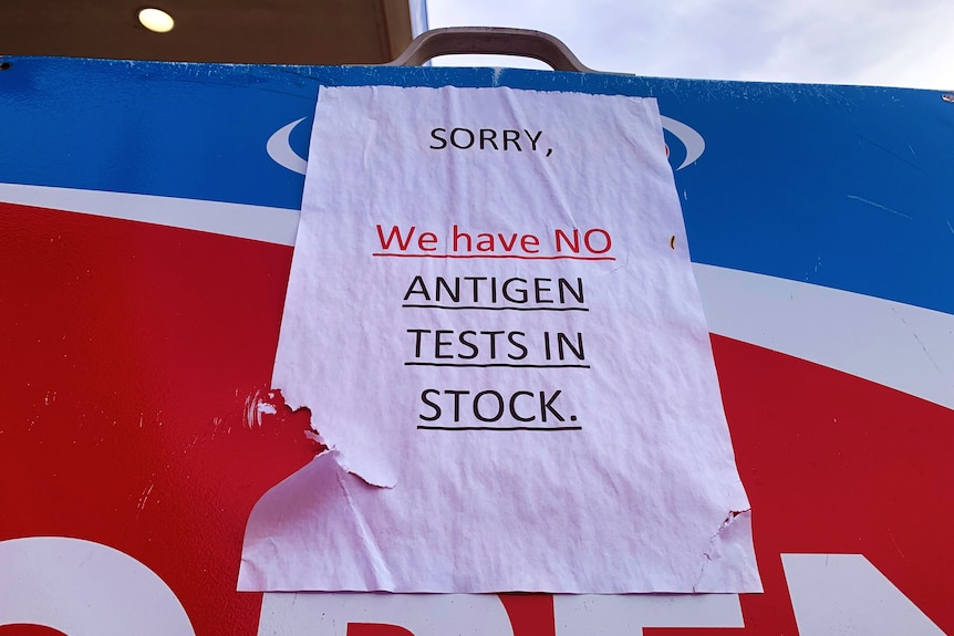 sign that reads sorry we have no antigen tests in stock
