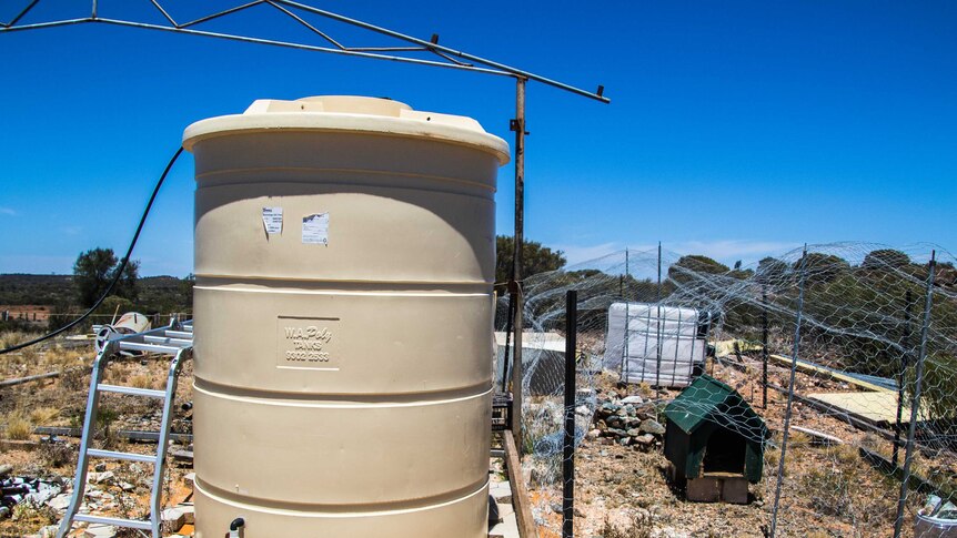 A water tank and chicken coop