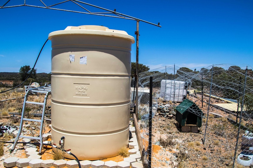 A water tank and chicken coop