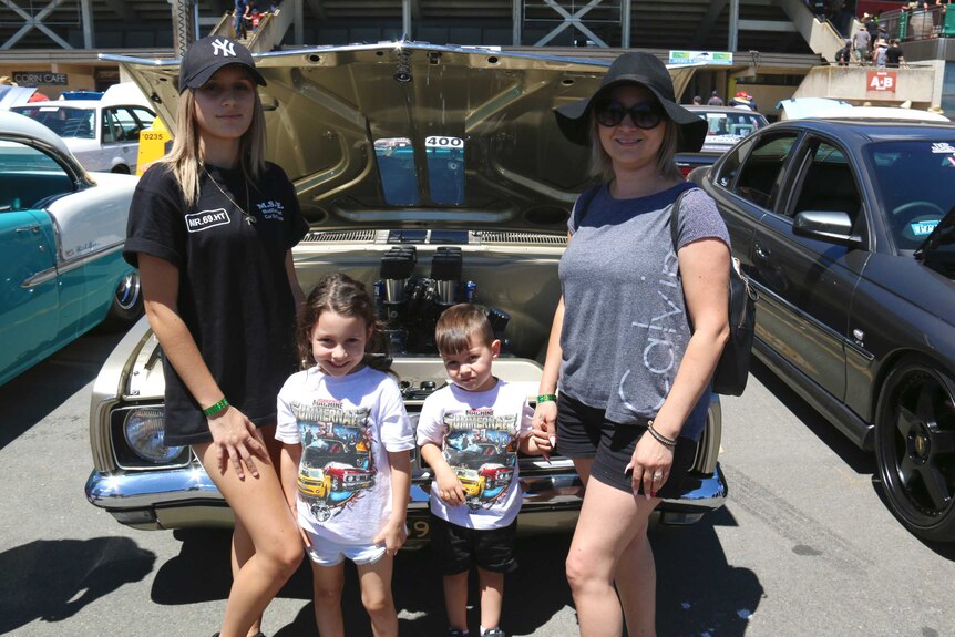 A woman and her children, including a teenage daughter, at Summernats in Canberra.
