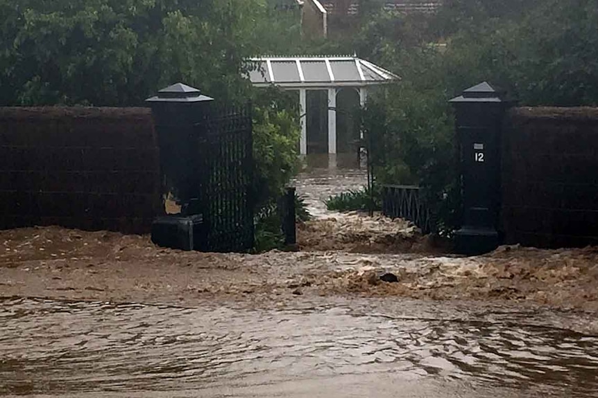 Flood water rises around home on Brownhill Creek Road.