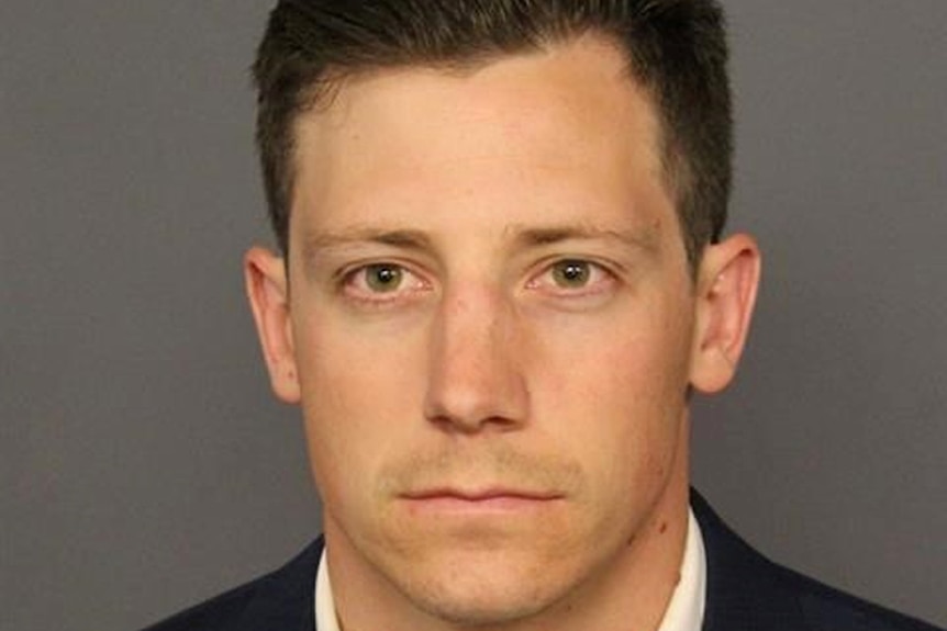 Head shot of Chase Bishop, the FBI agent who was charged after accidentally shooting his gun at a person while dancing in a bar.